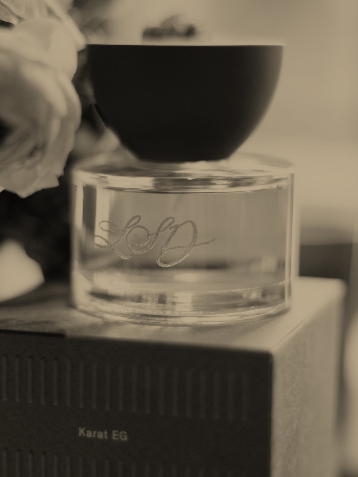 Hand-engraved monogram on a Maison d'Etto bottle, sitting on its Karat EG box